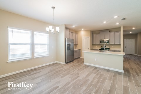 the kitchen and living room of an open floor plan