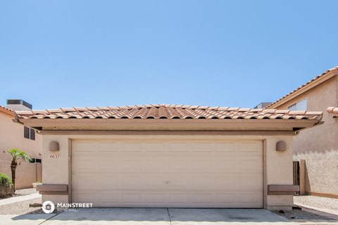 a garage door in front of a house