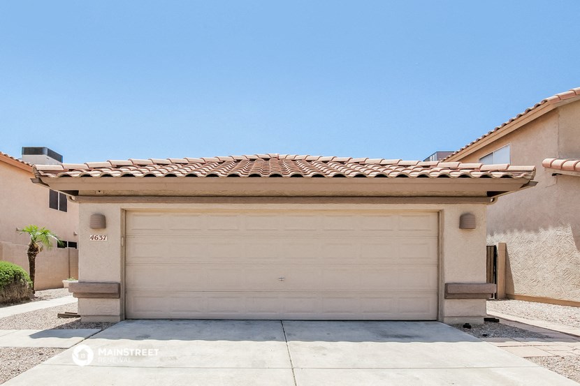 a garage door in front of a house