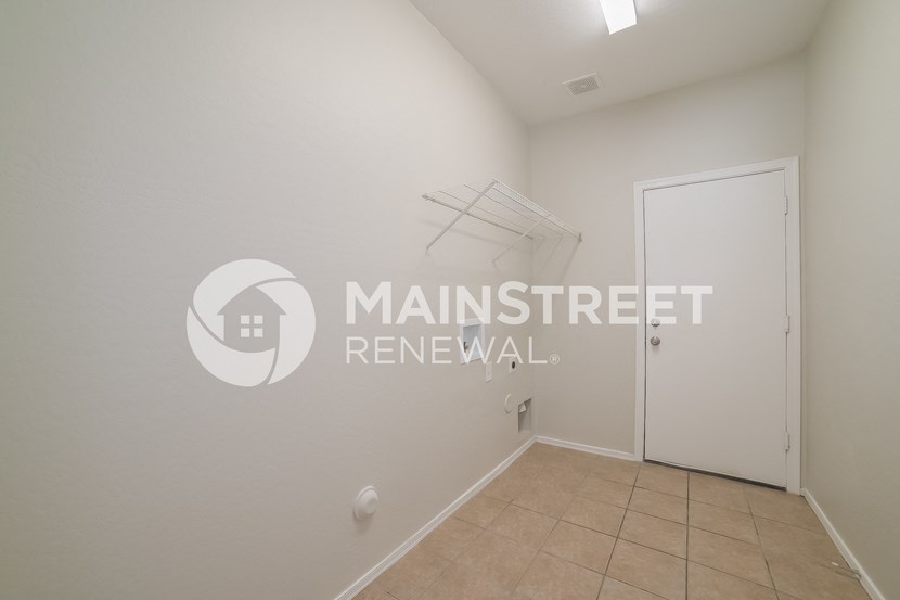 a bedroom apartment with a closet and a door