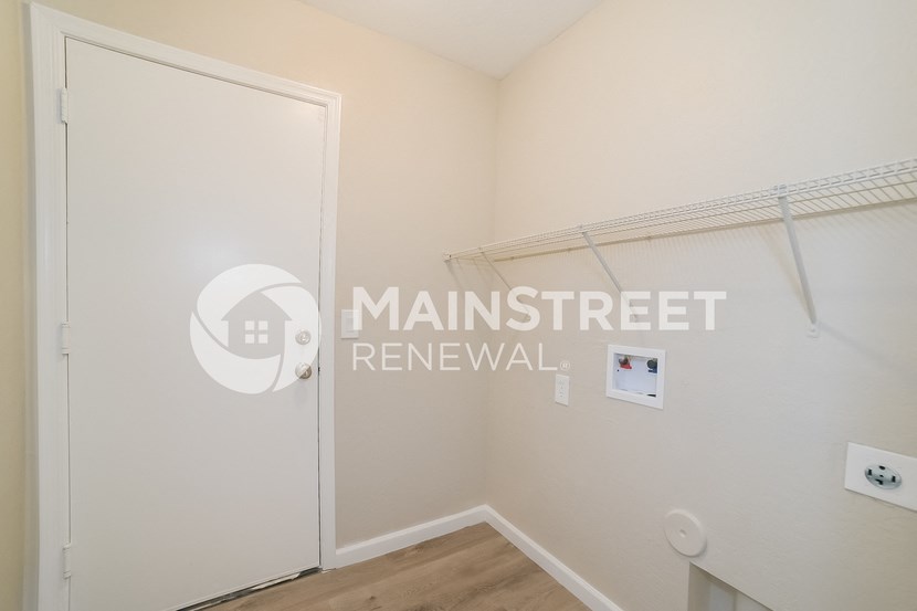 a bedroom with a closet and a door to a bathroom