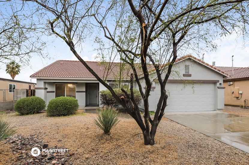 a house with a tree in the front of it