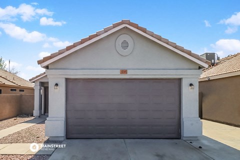 a garage door in front of a house