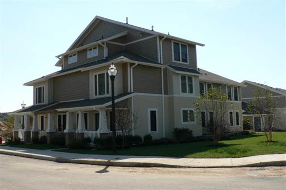 a large house with a street lamp in front of it
