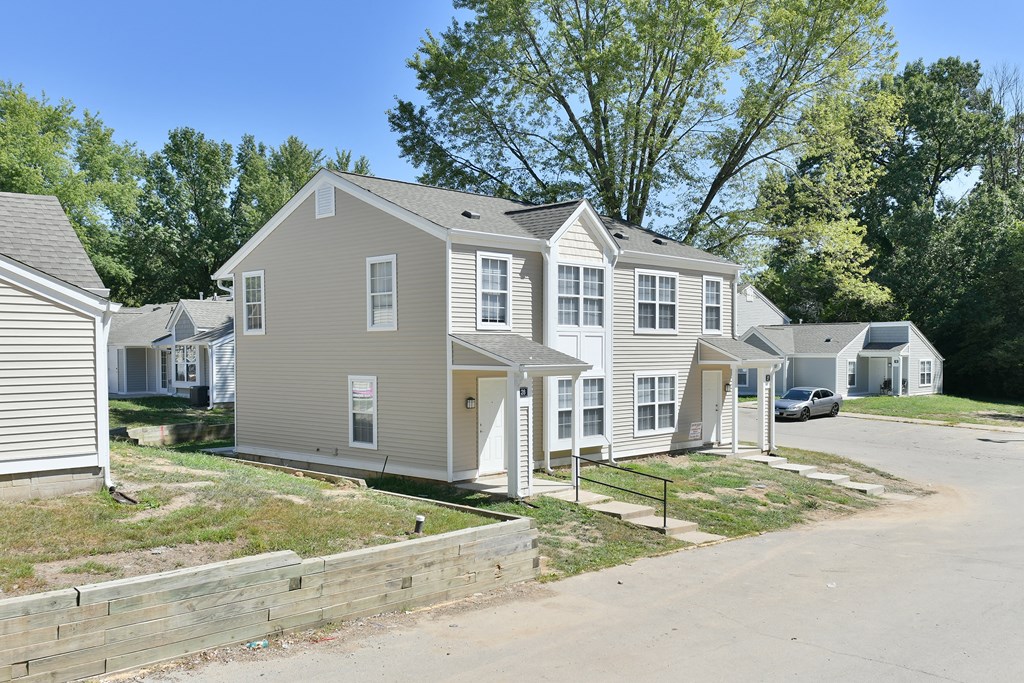 a row of houses on the side of a street