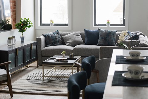 a living room with a couch and a table