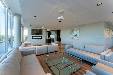 a large living room with couches and a glass table