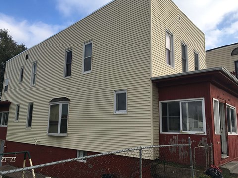a house with a fence in front of it