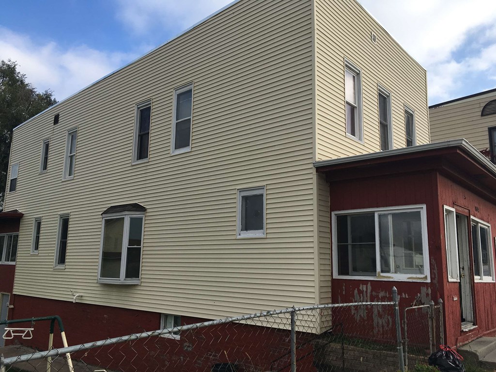 a house with a fence in front of it