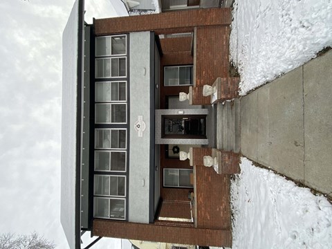 a view of a building from the outside in the snow