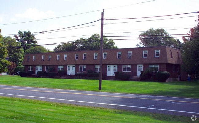 a large brick building on the side of a street