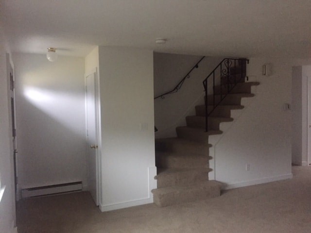an empty living room with stairs in it