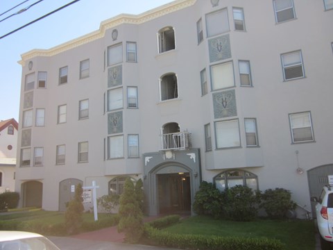 A building with a white cross in front of it.