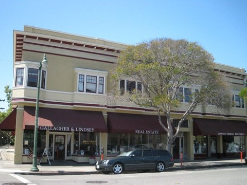 A street view of a building with Gallagher & Lindsey real estate on the front.