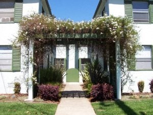 a house with a covered porch and a sidewalk