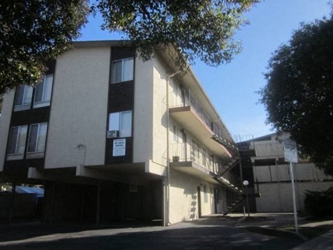 a large building with a street in front of it
