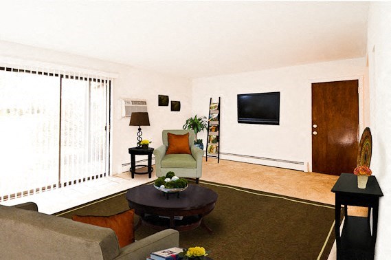 a living room with a couch a chair and a table