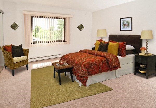 a bedroom with a bed and a window