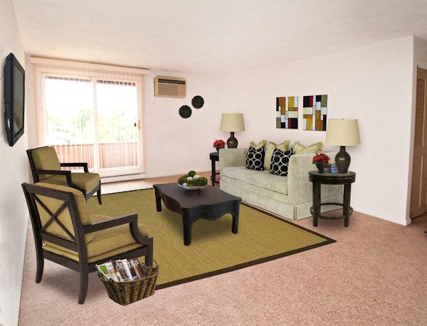 a living room with a couch and two chairs