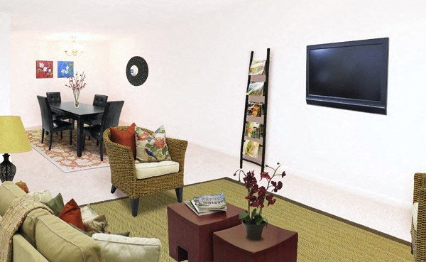 a living room with a table and a television