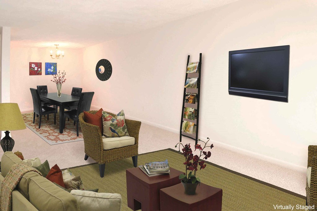 a living room with a table and a television