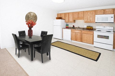 a kitchen and dining room with a table and chairs