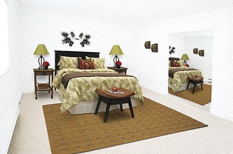 a bedroom with a bed and two lamps