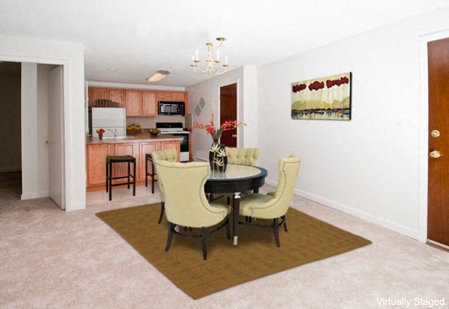 a dining room with a table and chairs and a kitchen