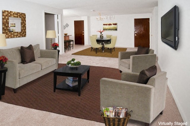 a living room with couches a table and a television