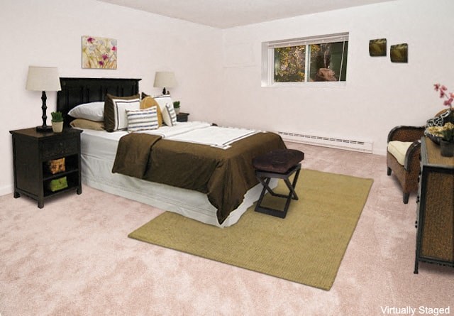 a bedroom with a bed and a couch and a window