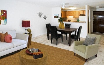 a living room and dining room with a table