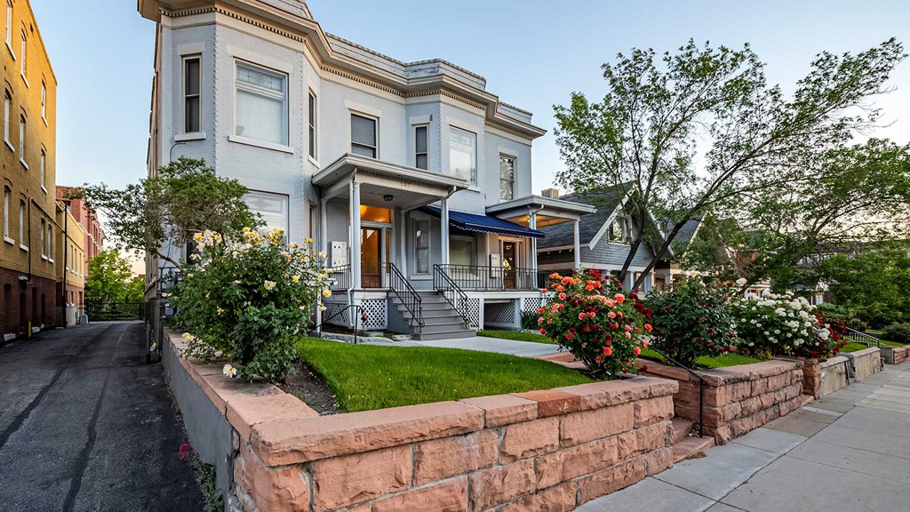 Light blue side exterior of First Avenue Home