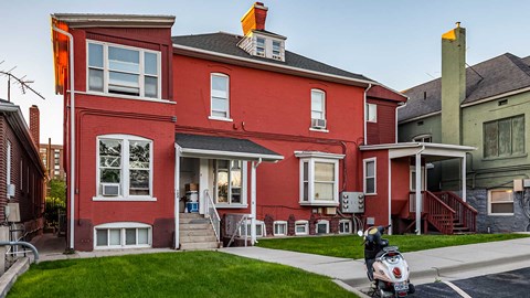 Red exterior of First Avenue Homes