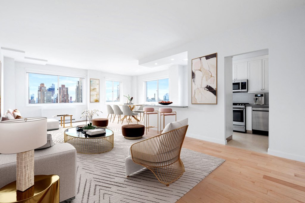 a living room with a couch and chairs and a table