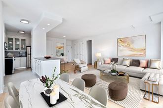 a living room filled with furniture and a large window