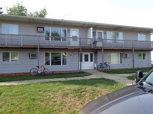 a house with three bikes parked in front of it