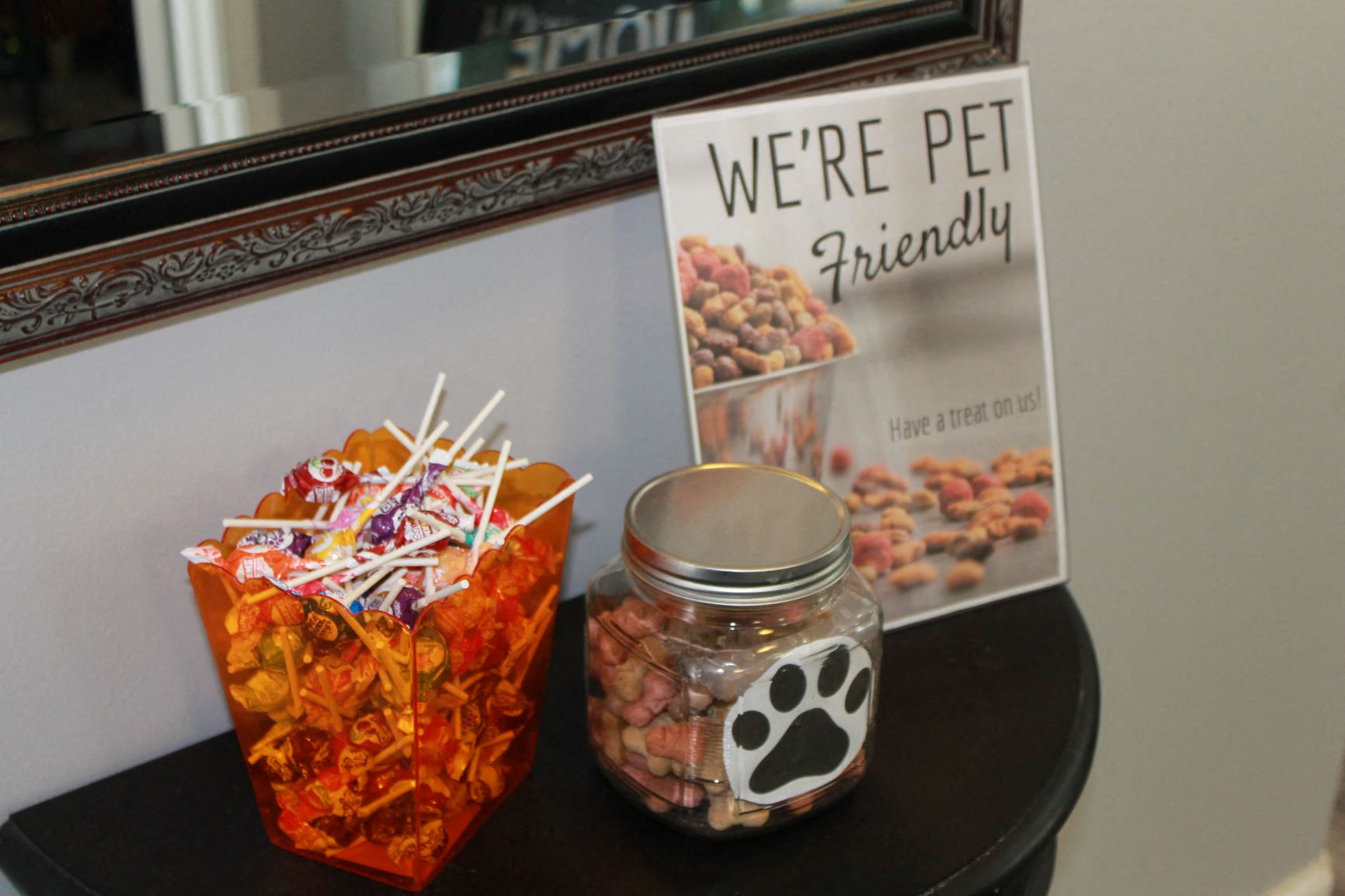 a table with a jar of pretzels and a sign that says were