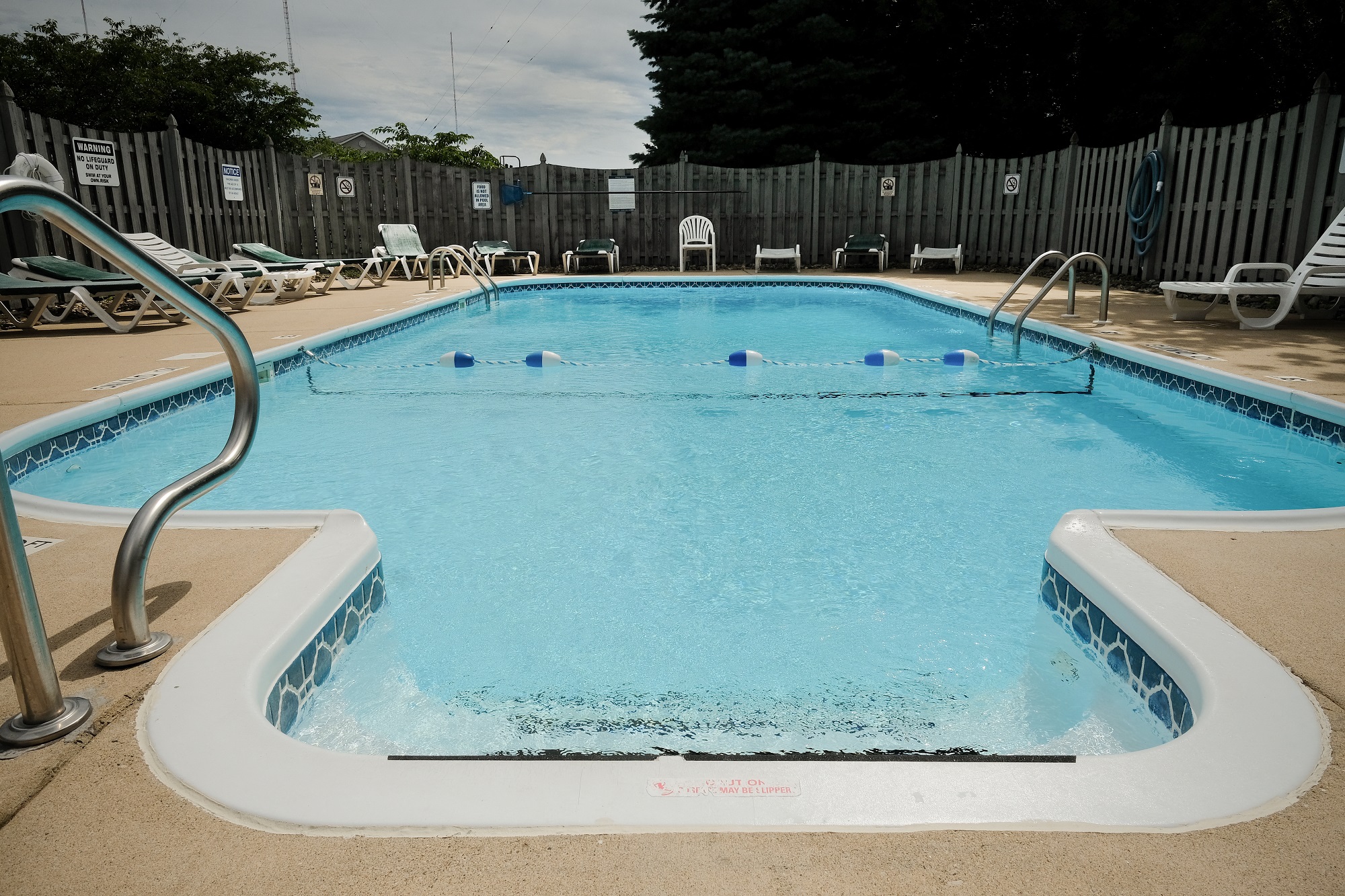 sparkling clean pool, crystal clear water, blue water, summer outdoor pool, at Regency Apartments in Bettendorf Iowa