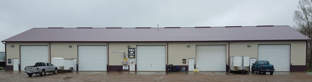 A large building with a truck parked in front of it.
