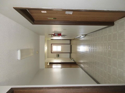 a view of a room from the top of a staircase