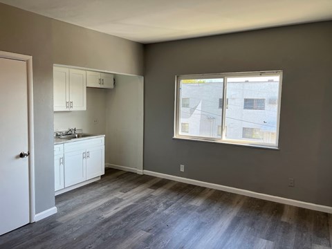 A room with a window and a sink.