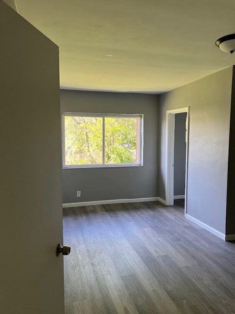 A room with a door and a window.