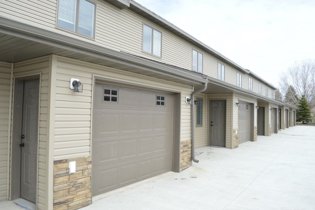 a row of garage doors on the side of a building