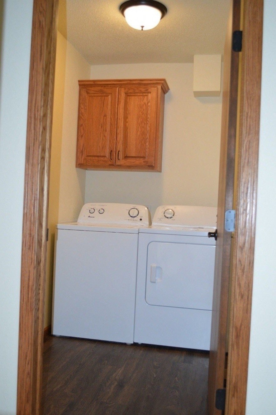 a laundry room with a washer and dryer in it