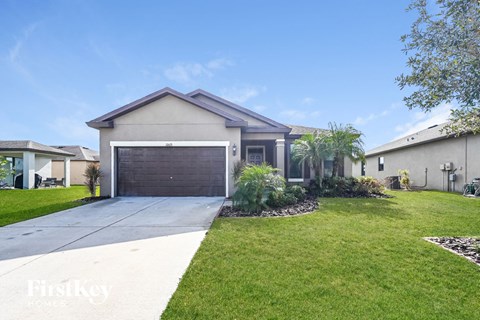 a house with a driveway and a garage door