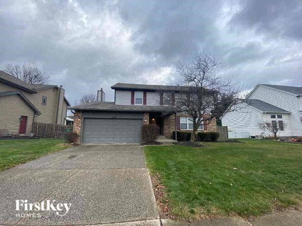 A house with a garage is for sale by FirstKey Homes.