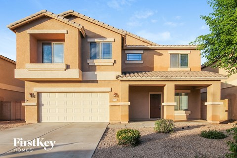 a house with a garage door in front of it