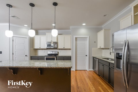 a kitchen with stainless steel appliances and a granite counter top