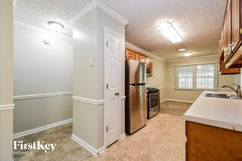 the kitchen is clean and ready to use with stainless steel appliances