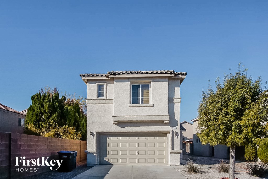 A modern house with a garage is for sale by FirstKey Homes.